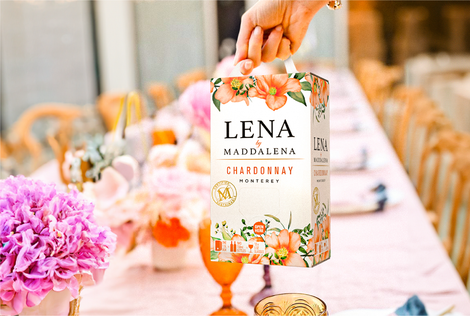 LENA by Maddalena Chardonnay on a table with flowers