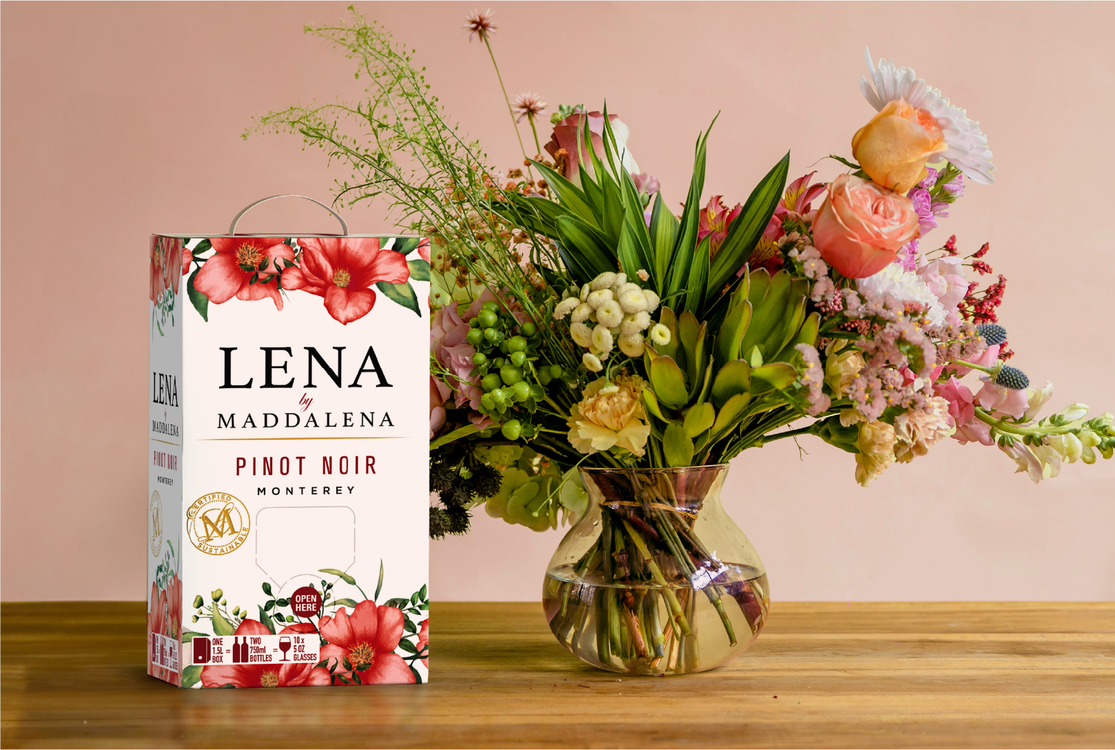 LENA by Maddalena Pinot Noir on a table with flowers